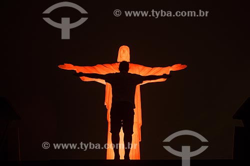  Christ the Redeemer (1931) with special lighting - orange - due to the campaign against skin cancer  - Rio de Janeiro city - Rio de Janeiro state (RJ) - Brazil