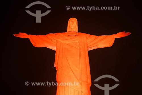  Christ the Redeemer (1931) with special lighting - orange - due to the campaign against skin cancer  - Rio de Janeiro city - Rio de Janeiro state (RJ) - Brazil