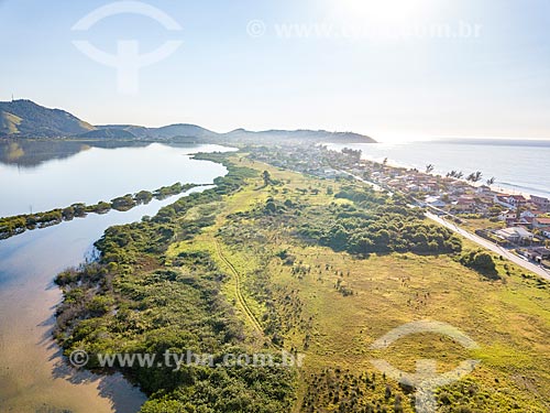  Picture taken with drone of the Aracatiba Lagoon - to the left - with the Barra de Marica Beach  - Marica city - Rio de Janeiro state (RJ) - Brazil