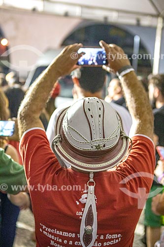  Man with cell phone wearing leather hat during meeting Ato da Virada (Turnover Act) with Fernando Haddad - presidential candidate for the  Workers Party (PT)  - Rio de Janeiro city - Rio de Janeiro state (RJ) - Brazil
