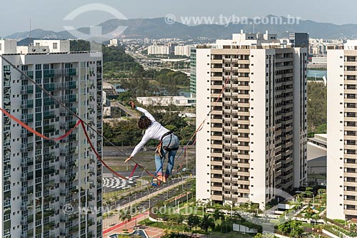  Practitioner of slackline between the buildings of Pura Island Village of Athletes - Residential Condominium where athletes stayed during the Olympic Games - Rio 2016  - Rio de Janeiro city - Rio de Janeiro state (RJ) - Brazil