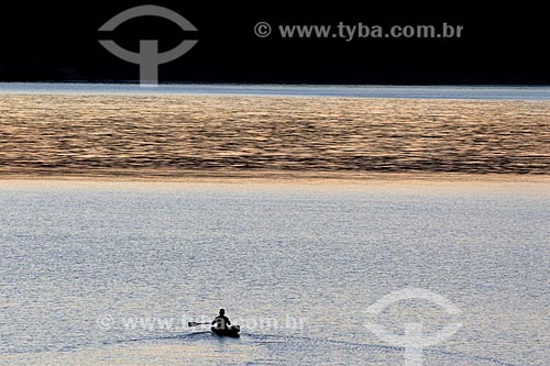  Silhouette of riverine sailing on the Uatuma River during the sunset  - Amazonas state (AM) - Brazil