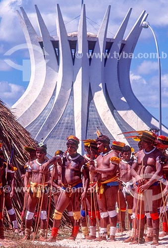  Indigenous occupation in Brasilia with the Metropolitan Cathedral of Our Lady of Aparecida (1970) - also known as Cathedral of Brasilia - in the background  - Brasilia city - Distrito Federal (Federal District) (DF) - Brazil