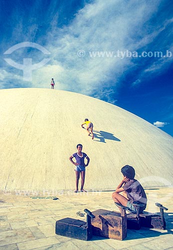  Boys playing in the National Congress dish (Federal Senate) during the construction of Brasilia  - Brasilia city - Distrito Federal (Federal District) (DF) - Brazil