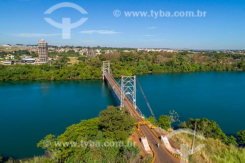  Picture taken with drone of the Affonso Penna Suspension Bridge (1909) over of Paranaiba River - natural boundary between Goias and Minas Gerais states - with the Itumbiara city in the background  - Arapora city - Minas Gerais state (MG) - Brazil