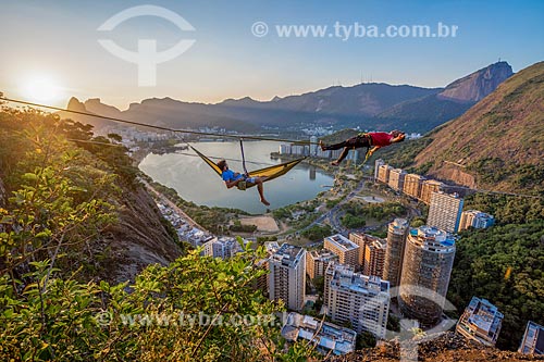  Practitioners of slackline resting - Cantagalo Hill during the sunset  - Rio de Janeiro city - Rio de Janeiro state (RJ) - Brazil