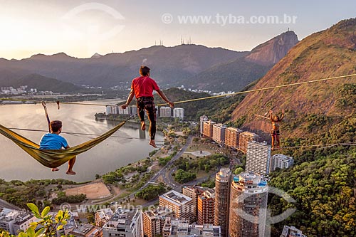  Practitioners of slackline resting - Cantagalo Hill during the sunset  - Rio de Janeiro city - Rio de Janeiro state (RJ) - Brazil