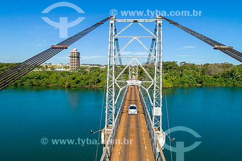  Picture taken with drone of the Affonso Penna Suspension Bridge (1909) over of Paranaiba River - boundary between Goias and Minas Gerais states - with the Arapora city in the background  - Itumbiara city - Goias state (GO) - Brazil