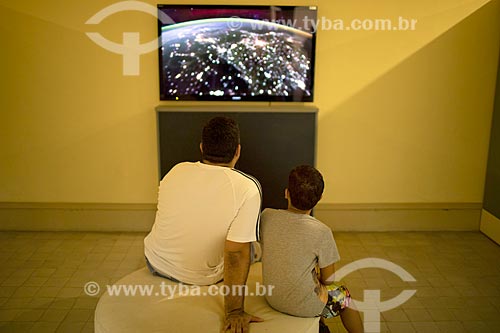  Man and boy observing exhibit inside of the Museum of Astronomy and Related Sciences - National Observatory  - Rio de Janeiro city - Rio de Janeiro state (RJ) - Brazil