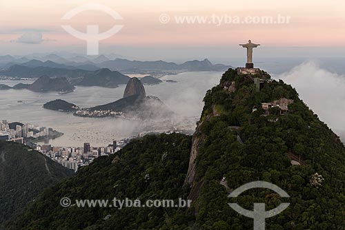  Aerial photo of the Christ the Redeemer with the Sugarloaf in the background during the sunset with fog  - Rio de Janeiro city - Rio de Janeiro state (RJ) - Brazil