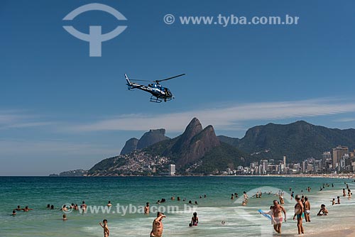  Helicopter of the Military Police flying over the Ipanema Beach with the Morro Dois Irmaos (Two Brothers Mountain) and Rock of Gavea in the background  - Rio de Janeiro city - Rio de Janeiro state (RJ) - Brazil