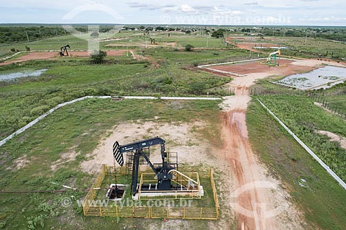  Picture taken with drone of the beam pumping suction - also known as Cavalo de pau (wooden horse) - extracting petroleum  - Macau city - Rio Grande do Norte state (RN) - Brazil