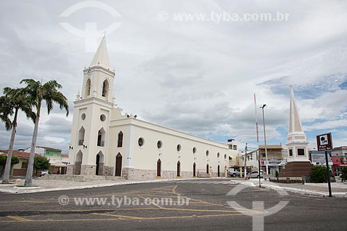  Facade of the Saint Anne Church (1808) - to the left - with the Monument to Ulisses Telemaco (1928) - Cristo Rei Square (Christ the King Square) - to the right  - Currais Novos city - Rio Grande do Norte state (RN) - Brazil