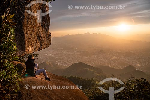  Man observing the landscape from Bico do Papagaio Mountain - Tijuca National Park during the sunset  - Rio de Janeiro city - Rio de Janeiro state (RJ) - Brazil