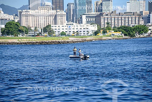  View of fishermen during sightseeing boat from Guanabara Bay with the buildings from the city center of Rio de Janeiro in the background  - Rio de Janeiro city - Rio de Janeiro state (RJ) - Brazil