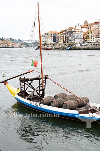  Boat with barrels of Port wine berthed on the banks of the Douro River  - Porto city - Porto district - Portugal
