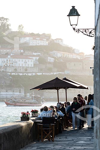 Restaurants tables on the banks of the Douro River during the sunset  - Porto city - Porto district - Portugal