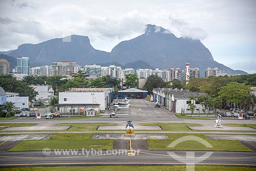  Aerial photo of the Roberto Marinho Airport runway - also known as Jacarepagua Airport - with the Rock of Gavea in the background  - Rio de Janeiro city - Rio de Janeiro state (RJ) - Brazil