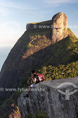  Man on the summit of Pedra Bonita (Bonita Stone) observing view with the Rock of Gavea in the background  - Rio de Janeiro city - Rio de Janeiro state (RJ) - Brazil