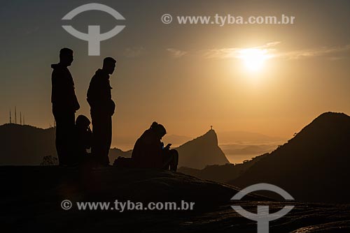  Group of people on the summit of Pedra Bonita (Bonita Stone) observing view with the Christ the Redeemer in the background  - Rio de Janeiro city - Rio de Janeiro state (RJ) - Brazil