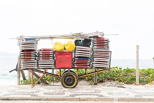  Detail of cargo trolley - man carrying a cart - with beach chairs - Ipanema Beach waterfront  - Rio de Janeiro city - Rio de Janeiro state (RJ) - Brazil