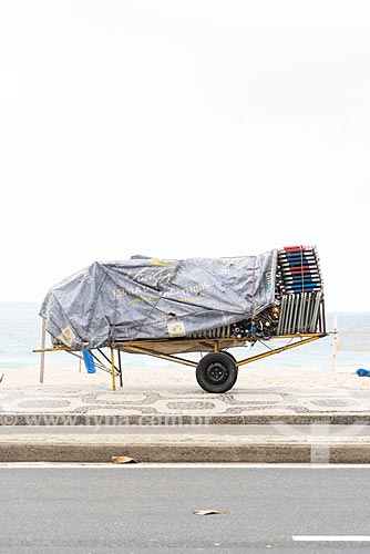  Detail of cargo trolley - man carrying a cart - with beach chairs - Ipanema Beach waterfront  - Rio de Janeiro city - Rio de Janeiro state (RJ) - Brazil