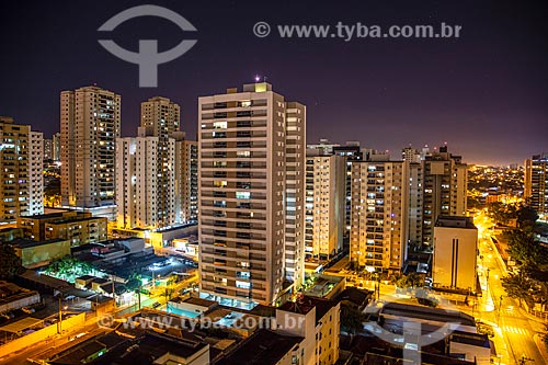  Picture taken with drone of the building and houses - Santa Cruz de Jose Jacques neighborhood at night  - Ribeirao Preto city - Sao Paulo state (SP) - Brazil