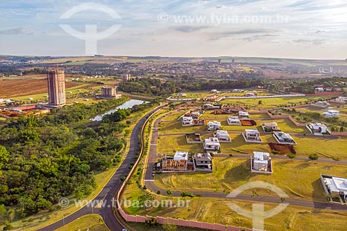  Picture taken with drone of the Olhos DAgua (Water Eyes) Park - to the left - with the residential condominium  - Ribeirao Preto city - Sao Paulo state (SP) - Brazil