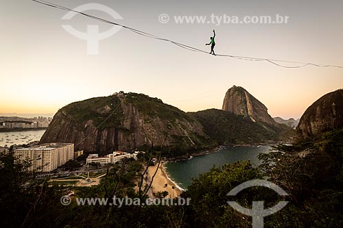  Practitioner of slackline with the Sugarloaf in the background during the sunset  - Rio de Janeiro city - Rio de Janeiro state (RJ) - Brazil