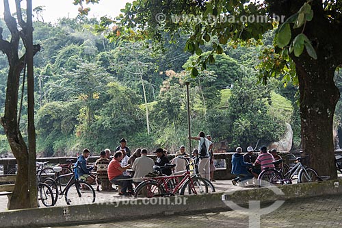 People playing cards in recreation area - mouth of Grande River  - Ubatuba city - Sao Paulo state (SP) - Brazil