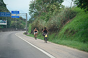  People riding bikes on the side of Washington Luis Highway (BR-040)
  - Duque de Caxias city - Rio de Janeiro state (RJ) - Brazil