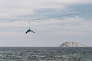  Practitioner of slackline - Rio de Janeiro waterfront with the Natural Monument of Cagarras Island in the background  - Rio de Janeiro city - Rio de Janeiro state (RJ) - Brazil