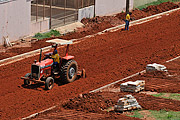  Tractor works in the preparation of soil in the street that will be paved  - Sao Jose do Rio Preto city - Sao Paulo state (SP) - Brazil