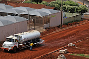  Water truck watering compacted soil for paving  - Sao Jose do Rio Preto city - Sao Paulo state (SP) - Brazil