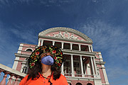 Woman with mask for protection against Coronavirus - Amazon Theatre (1896) in the background  - Manaus city - Amazonas state (AM) - Brazil