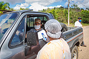  Nurse holding thermometer - Public health professionals perform sanitary control at the entrance to the city of Guarani - Coronavirus Crisis  - Guarani city - Minas Gerais state (MG) - Brazil
