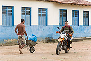  Indian carrying garbage bag in wheelbarrow - Tupiniquim ethnic group Pau Brasil  - Aracruz city - Espirito Santo state (ES) - Brazil