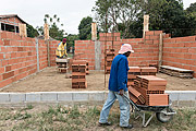  Indigenous laying bricks under construction - Tupiniquim ethnic group Pau Brasil  - Aracruz city - Espirito Santo state (ES) - Brazil
