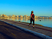  Woman walking on Beira Mar Norte at dawn  - Florianopolis city - Santa Catarina state (SC) - Brazil