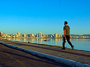  Man walking on Beira Mar Norte at dawn  - Florianopolis city - Santa Catarina state (SC) - Brazil