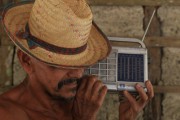 Riverine farmer with old radio - Maues city - Amazonas state (AM) - Brazil