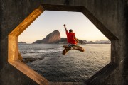 Man jumping in the Guanabara Bay from the footbridge of the Tamandare da Laje Fort (1555) with the Sugar Loaf in the background - Rio de Janeiro city - Rio de Janeiro state (RJ) - Brazil