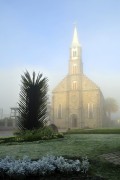 Facade of Saint Peter Apostle Mother Church (1917) with fog during the dawn - Gramado city - Rio Grande do Sul state (RS) - Brazil