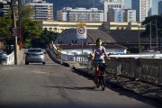 Person riding a bicycle wearing a protective mask - Coronavirus Crisis - Rio de Janeiro city - Rio de Janeiro state (RJ) - Brazil