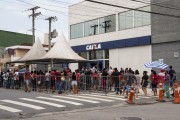 Queue of people in front of Caixa Economica Federal agency looking for information on emergency aid during the pandemic - Coronavirus Crisis - Caraguatatuba city - Sao Paulo state (SP) - Brazil