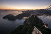 Cable car making the crossing between the Urca Mountain and Sugarloaf during the sunset - Rio de Janeiro city - Rio de Janeiro state (RJ) - Brazil