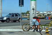 Man filling bicycle tire at gas station - Rio de Janeiro city - Rio de Janeiro state (RJ) - Brazil