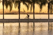 Cyclist on the edge of Guanabara Bay at sunset - Rio de Janeiro city - Rio de Janeiro state (RJ) - Brazil