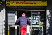 Man waiting for service in convenience store - Porto Alegre city - Rio Grande do Sul state (RS) - Brazil