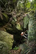 Man rappelling inside cave entrance - Gruta do Archer - Tijuca National Park  - Rio de Janeiro city - Rio de Janeiro state (RJ) - Brazil
